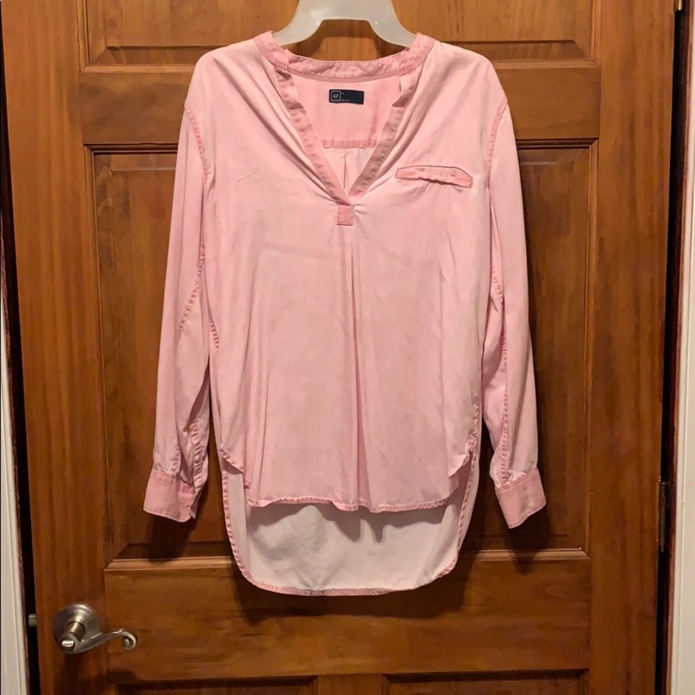 V neck, long sleeve blouse. Roll up cuffed sleeve.